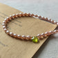 Collana perle rosa e peridoto